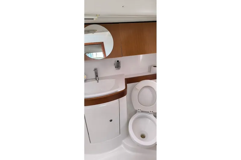  Yacht Photos Pics Beneteau Oceanis 40 yacht bathroom with sink, mirror, and toilet, 2011 model.