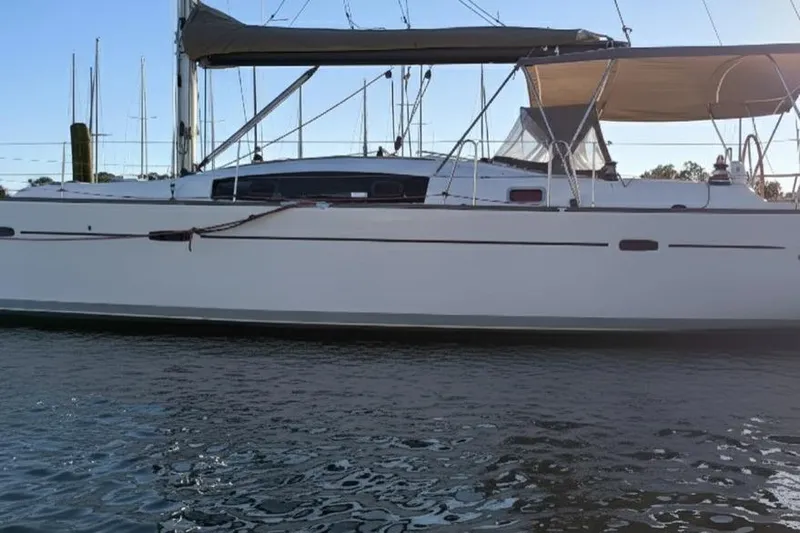  Yacht Photos Pics 2011 Beneteau Oceanis 40 sailboat on calm water, side view.
