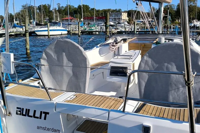  Yacht Photos Pics 2011 Beneteau Oceanis 40 sailboat docked in a marina, rear view.