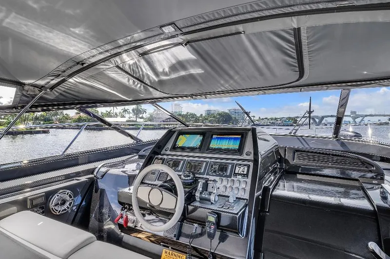 Joe Yacht Photos Pics Luxurious 2015 Riva 63 Virtus yacht cockpit with advanced navigation system and waterfront view.