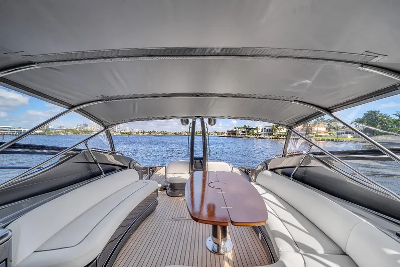 Joe Yacht Photos Pics Luxurious 2015 Riva 63 Virtus yacht interior with elegant seating and wooden table.