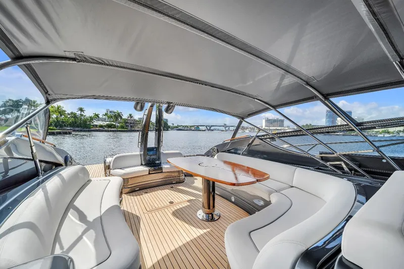 Joe Yacht Photos Pics Luxurious 2015 Riva 63 Virtus yacht interior with elegant seating and scenic water view.