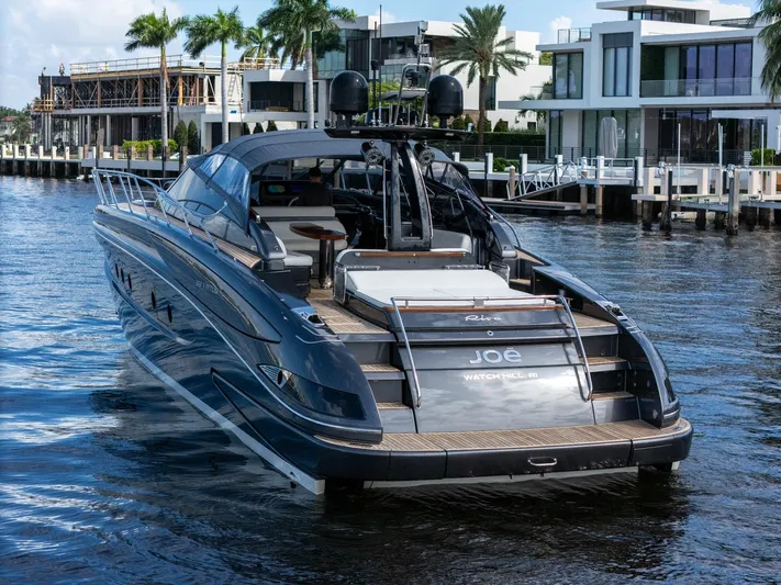 Joe Yacht Photos Pics Luxury 2015 Riva 63 Virtus yacht docked in a scenic waterfront setting.