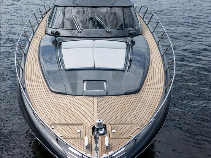 Joe Yacht Photos Pics 2015 Riva 63 Virtus yacht with sleek design and wooden deck on water.