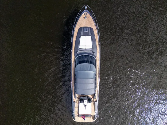 Joe Yacht Photos Pics Aerial view of 2015 Riva 63 Virtus yacht on dark water.