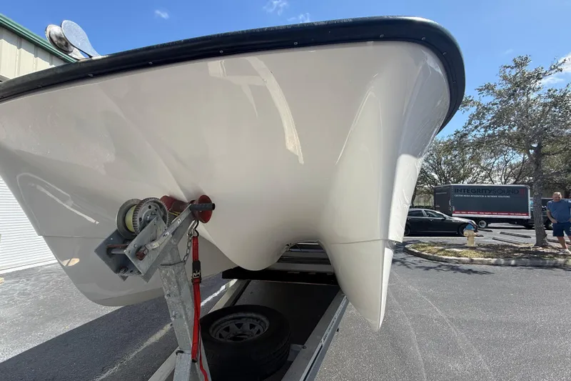  Yacht Photos Pics 2019 Calcutta 263 boat on trailer, parked outdoors under clear sky.