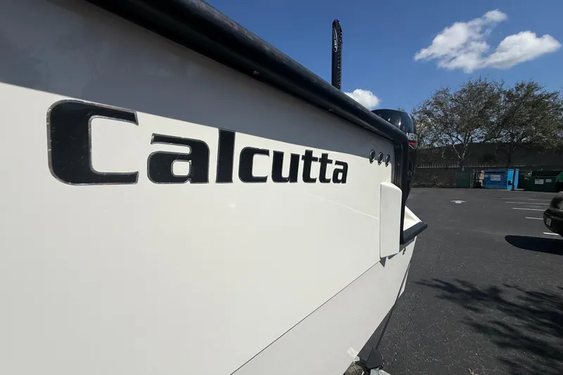  Yacht Photos Pics 2019 Calcutta 263 boat in parking lot under blue sky.