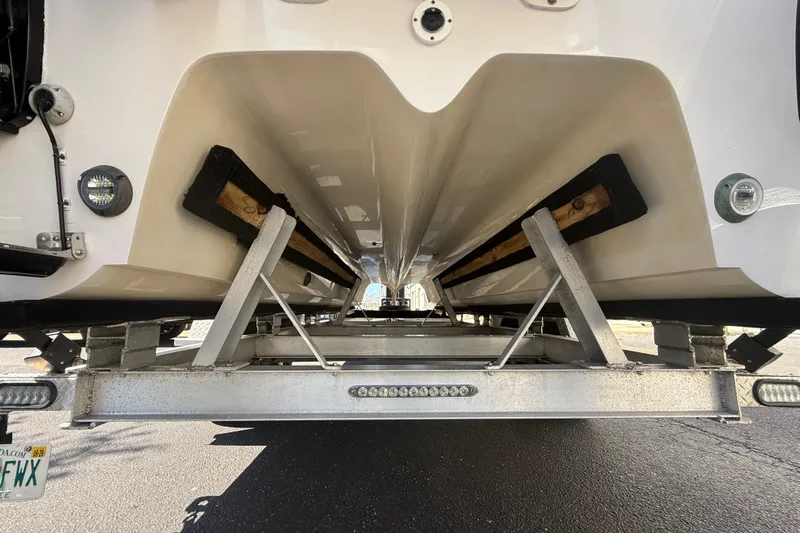  Yacht Photos Pics Underneath view of a 2019 Calcutta 263 boat on a trailer.