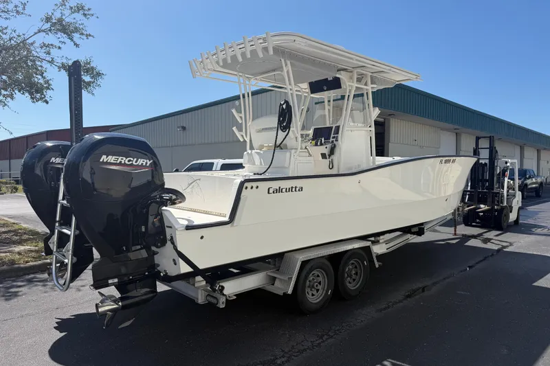  Yacht Photos Pics 2019 Calcutta 263 boat with dual Mercury engines on a trailer.