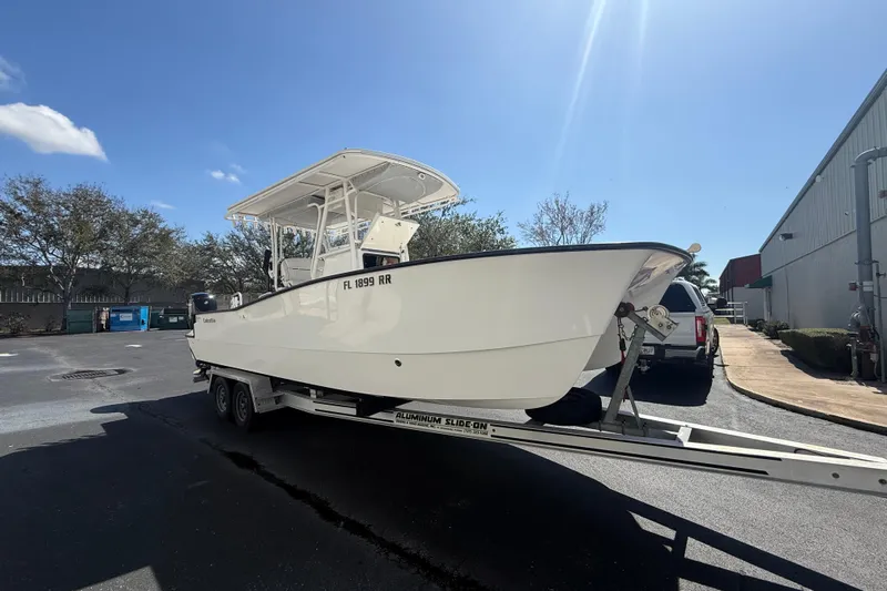  Yacht Photos Pics 2019 Calcutta 263 boat on trailer in sunny outdoor setting.