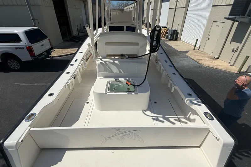  Yacht Photos Pics 2019 Calcutta 263 boat interior with fishing equipment, parked near industrial buildings.