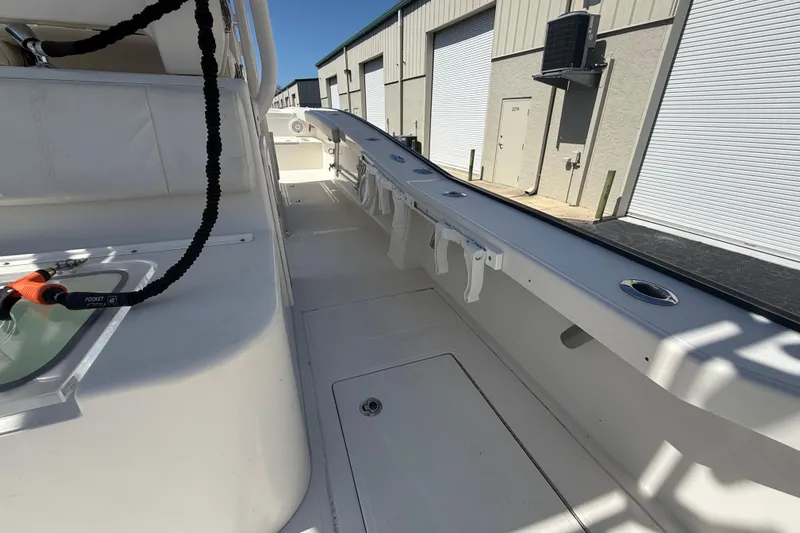  Yacht Photos Pics 2019 Calcutta 263 boat interior with rod holders and storage compartments.