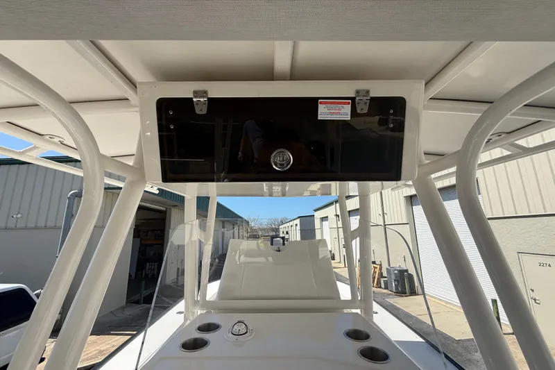 Yacht Photos Pics 2019 Calcutta 263 boat console with storage compartment and cup holders.