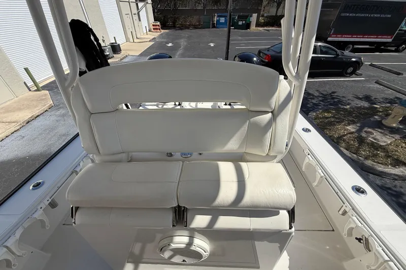  Yacht Photos Pics White seating on a 2019 Calcutta 263 boat, parked in a lot.