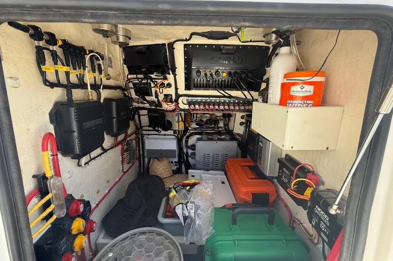  Yacht Photos Pics Electrical equipment setup inside a Calcutta 263 model, featuring organized wiring and storage.