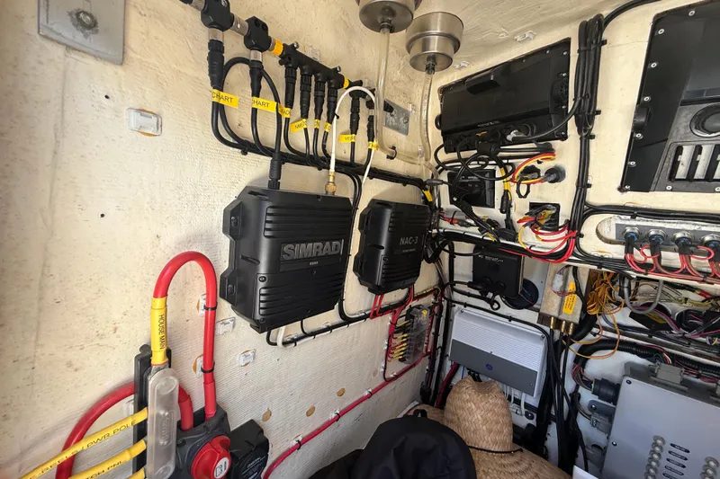  Yacht Photos Pics Electrical system setup in a 2019 Calcutta 263 boat, featuring Simrad equipment and organized wiring.