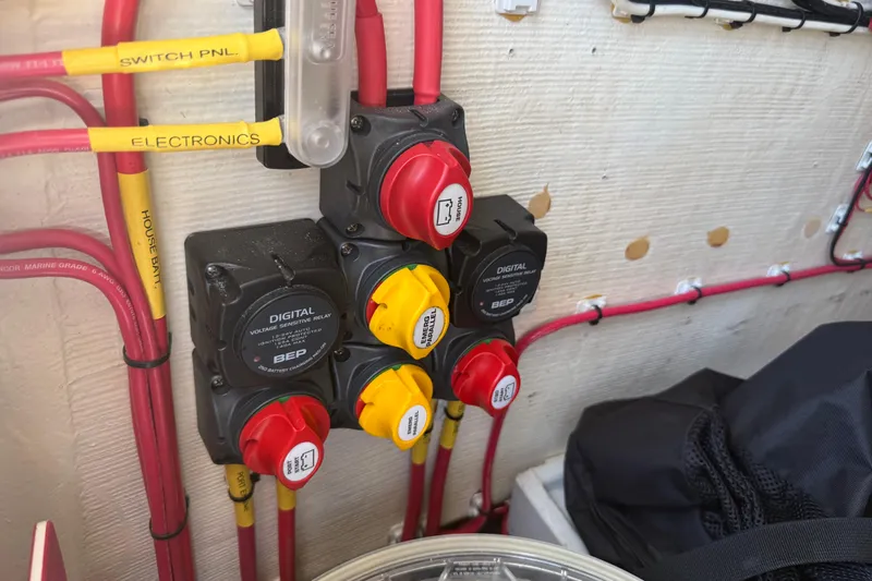  Yacht Photos Pics Electrical panel with labeled switches and wiring in a 2019 Calcutta 263 boat.