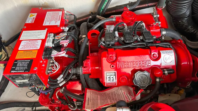  Yacht Photos Pics Red Westerbeke engine in 2021 Regal 33 Express boat, featuring multiport EFI system.