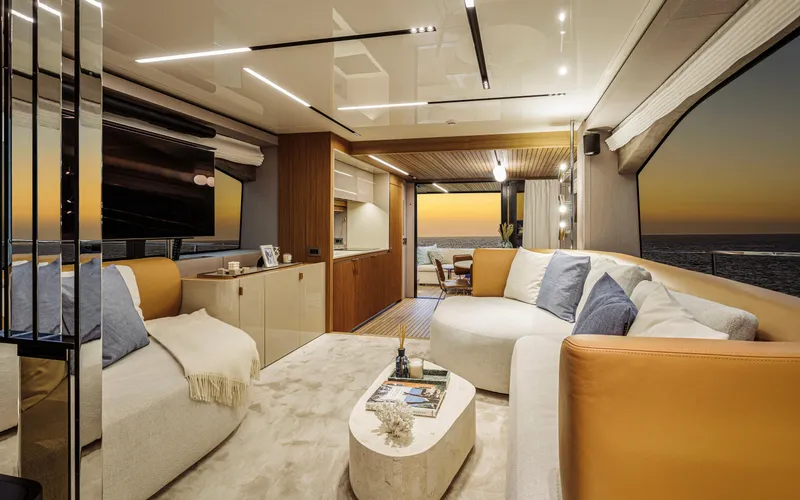  Yacht Photos Pics Luxurious interior of 2025 Cranchi Sessantadue 62 yacht at sunset, featuring elegant furnishings.