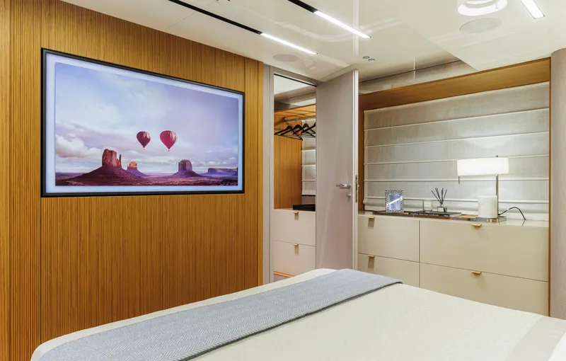  Yacht Photos Pics Luxurious interior of 2025 Cranchi Sessantadue 62 yacht with modern decor and wall art.