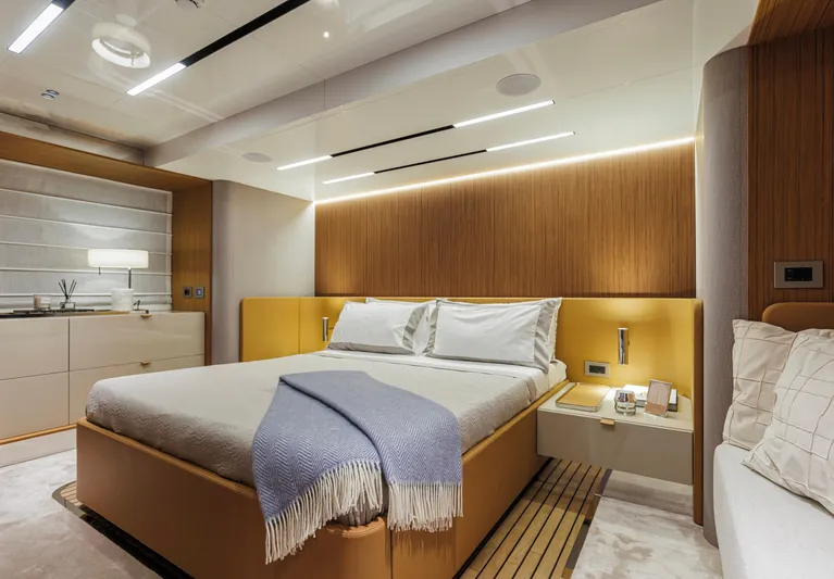  Yacht Photos Pics Luxurious bedroom interior of 2025 Cranchi Sessantadue 62 yacht with modern design elements.