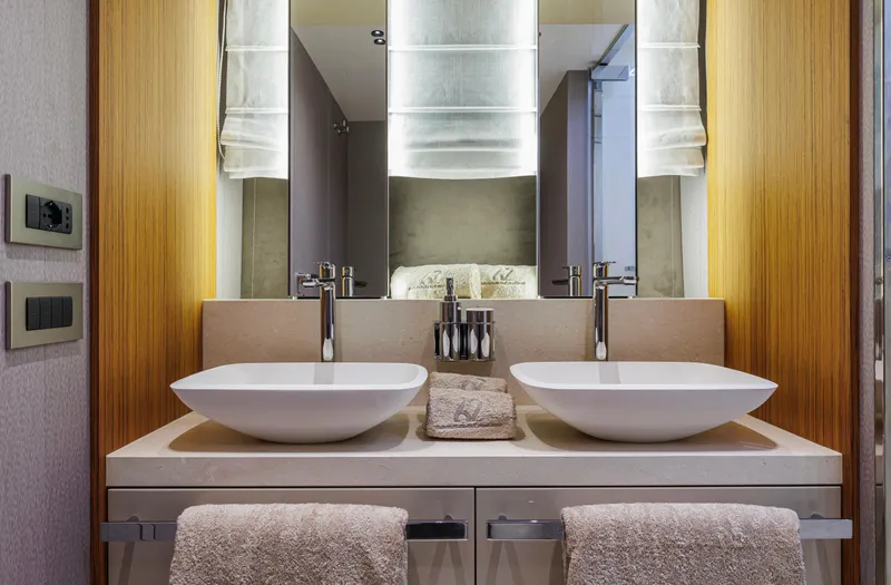  Yacht Photos Pics Luxurious bathroom in 2025 Cranchi Sessantadue 62 yacht with dual sinks and modern design.
