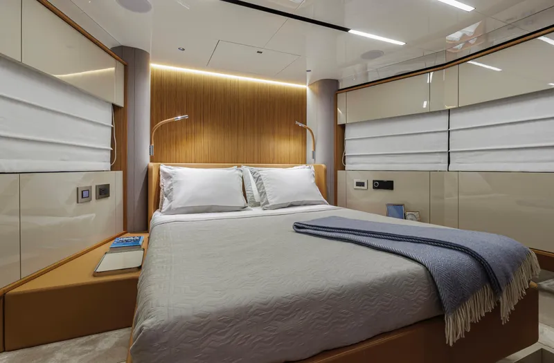  Yacht Photos Pics Luxurious bedroom interior of 2025 Cranchi Sessantadue 62 yacht with modern design.