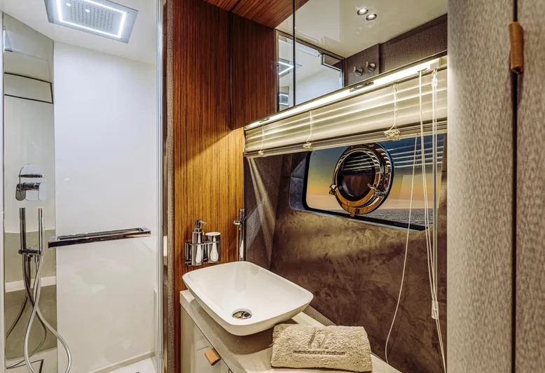  Yacht Photos Pics Luxurious bathroom interior of 2025 Cranchi Sessantadue 62 yacht with modern fixtures.