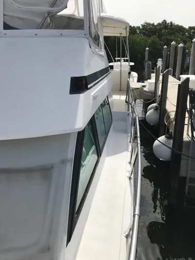  Yacht Photos Pics 1994 Hatteras 42 Cockpit Motor Yacht docked at marina.