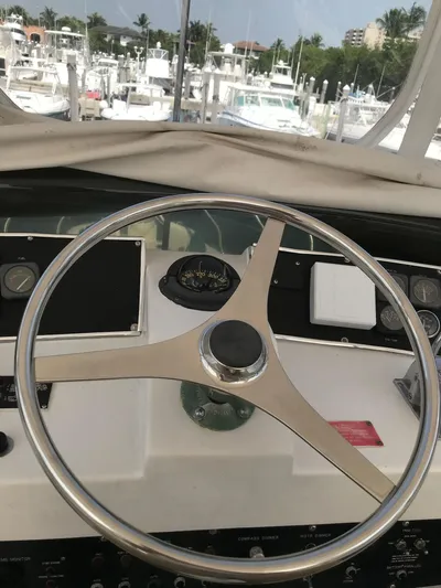  Yacht Photos Pics Steering wheel of a 1994 Hatteras 42 Cockpit Motor Yacht at a marina.