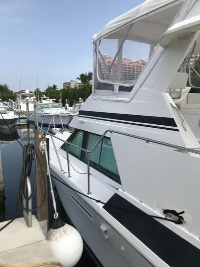  Yacht Photos Pics 1994 Hatteras 42 Cockpit Motor Yacht docked at marina, side view.
