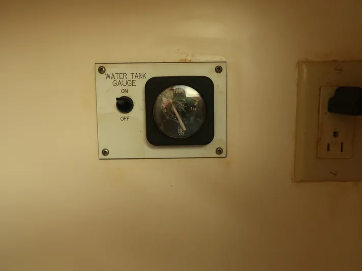  Yacht Photos Pics Water tank gauge on 1994 Hatteras 42 Cockpit Motor Yacht dashboard.