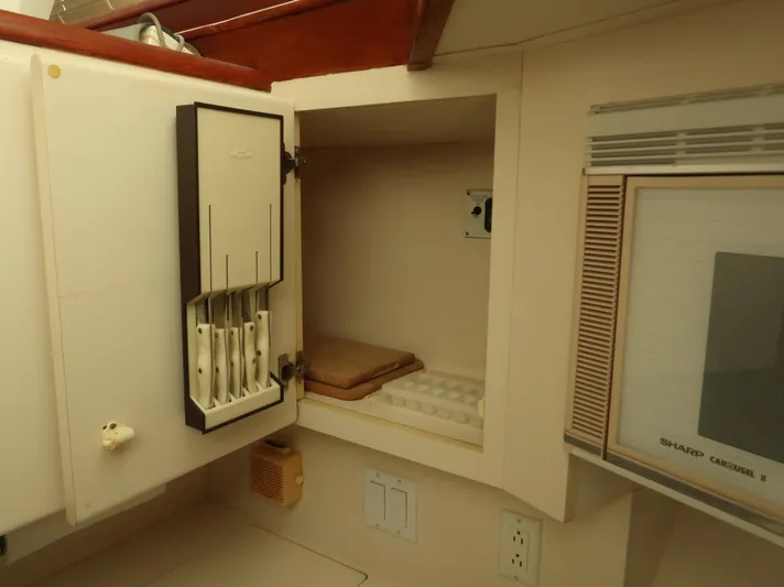  Yacht Photos Pics Interior of 1994 Hatteras 42 Cockpit Motor Yacht kitchen with knife holder and microwave.
