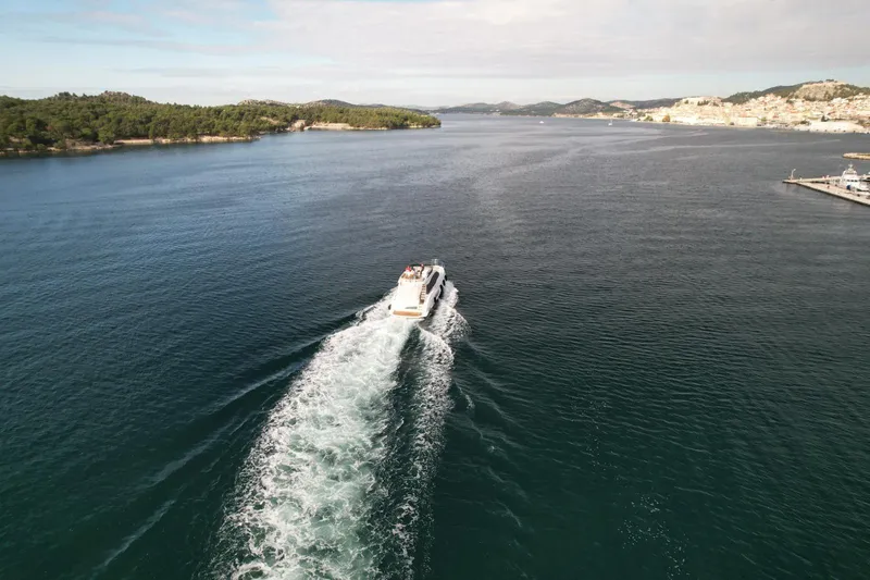  Yacht Photos Pics Aerial view of 2024 Azimut Fly 53 yacht cruising on a scenic waterway.