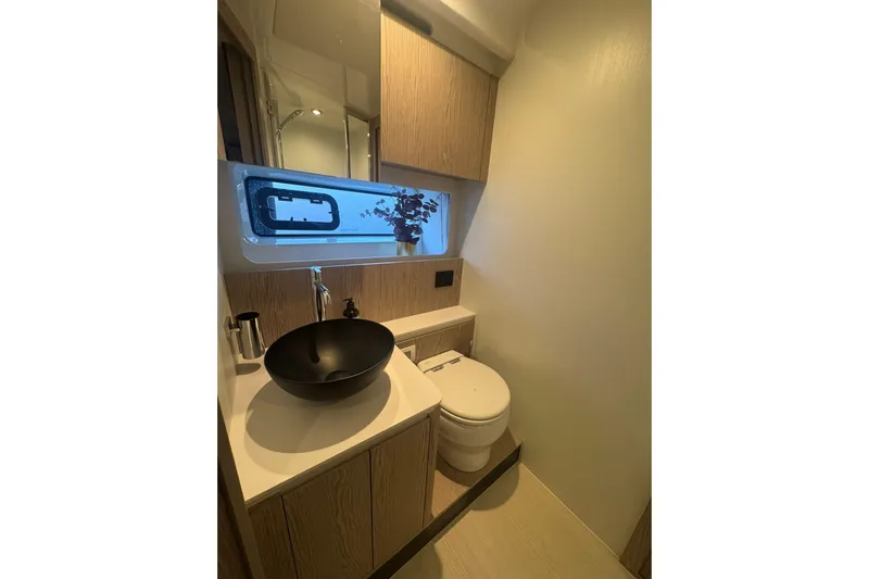  Yacht Photos Pics Luxurious bathroom in 2024 Azimut Fly 53 yacht with modern fixtures and elegant design.