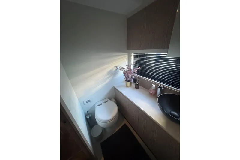  Yacht Photos Pics Luxurious bathroom in 2024 Azimut Fly 53 yacht with modern fixtures and decor.