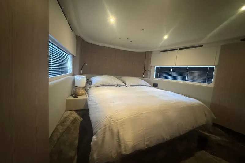  Yacht Photos Pics Luxurious bedroom interior of 2024 Azimut Fly 53 yacht with modern design and cozy ambiance.
