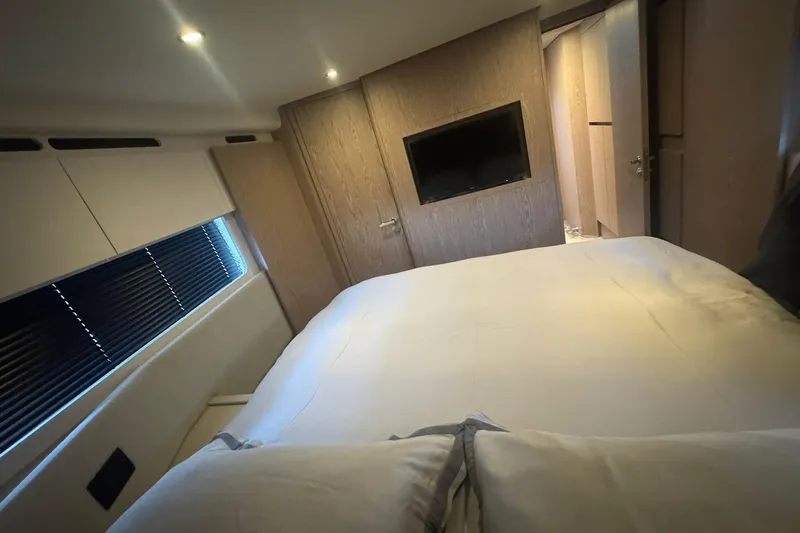  Yacht Photos Pics Luxurious bedroom interior of 2024 Azimut Fly 53 yacht with modern design.