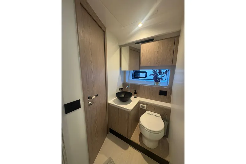  Yacht Photos Pics Luxurious bathroom interior of 2024 Azimut Fly 53 yacht with modern fixtures.