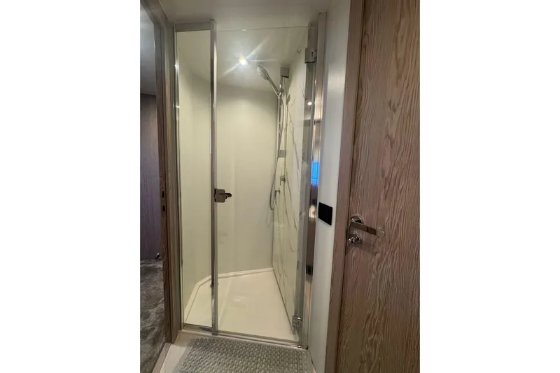  Yacht Photos Pics Luxurious shower in 2024 Azimut Fly 53 yacht, featuring sleek glass doors and modern fixtures.