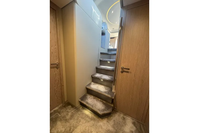  Yacht Photos Pics Luxurious interior staircase of 2024 Azimut Fly 53 yacht with modern design.