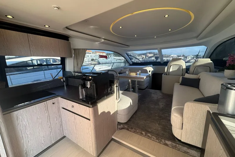  Yacht Photos Pics Luxurious interior of 2024 Azimut Fly 53 yacht with modern kitchen and seating area.
