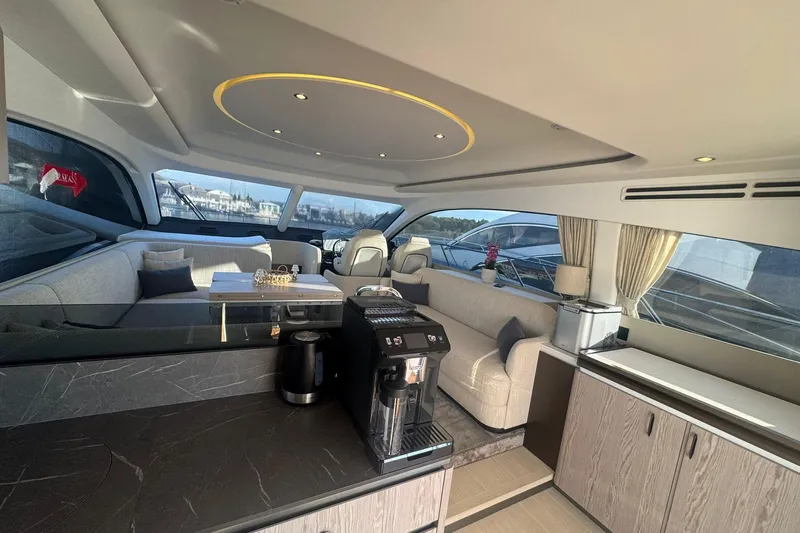  Yacht Photos Pics Luxurious interior of 2024 Azimut Fly 53 yacht with modern furnishings and panoramic windows.