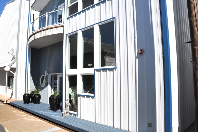  Yacht Photos Pics Exterior of 2004 Steelhead Marine Boat House with modern design and large windows.