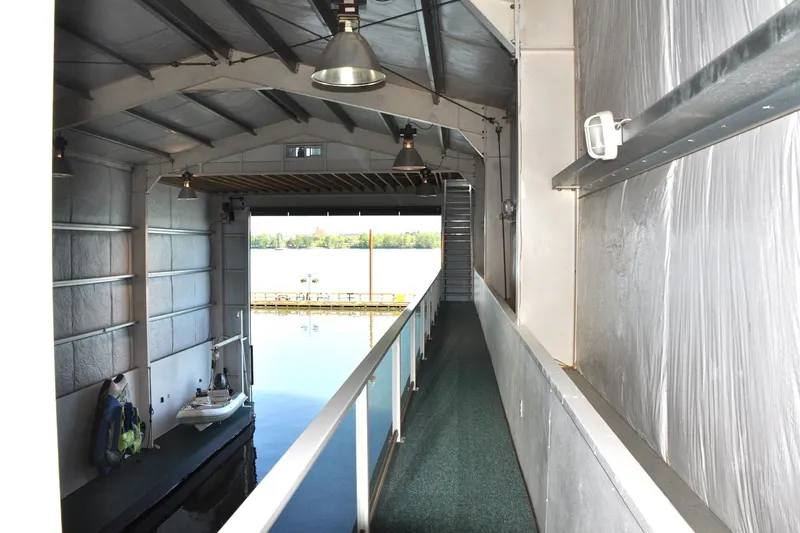  Yacht Photos Pics Interior of a 2004 Steelhead Marine Boat House with water view and walkway.