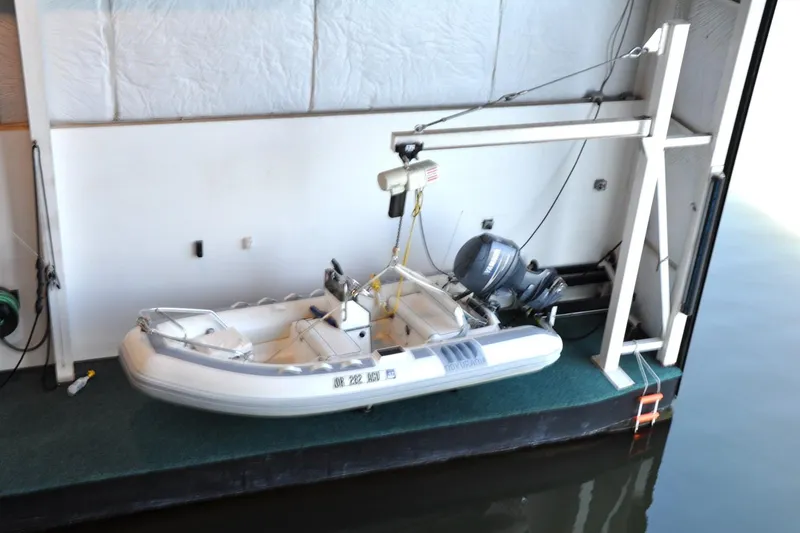  Yacht Photos Pics Inflatable boat in Steelhead Marine Boat House, 2004 model, with motor and hoist system.