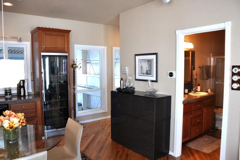  Yacht Photos Pics Interior of 2004 Steelhead Marine Boat House with modern kitchen and bathroom.