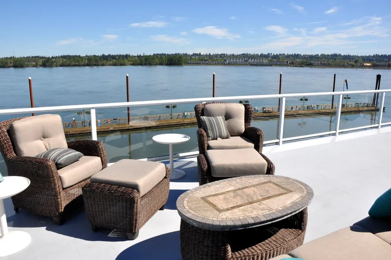  Yacht Photos Pics Outdoor seating on Steelhead Marine Boat House, overlooking serene river view, 2004 model.