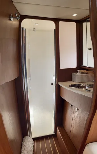 2008 Tiara 3500 Sovran Yacht Photos Pics 2008 Tiara Yachts 3500 Sovran bathroom with wooden cabinetry and modern shower.