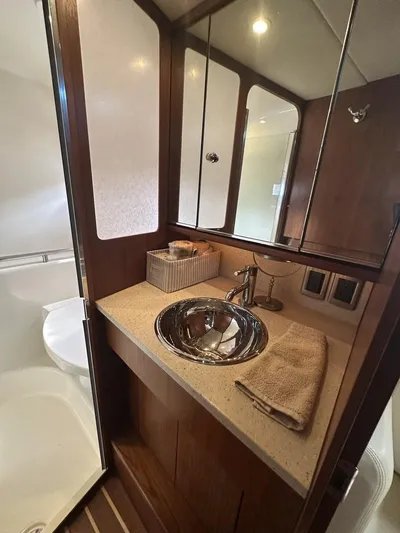 2008 Tiara 3500 Sovran Yacht Photos Pics 2008 Tiara Yachts 3500 Sovran bathroom with sleek sink and wooden cabinetry.